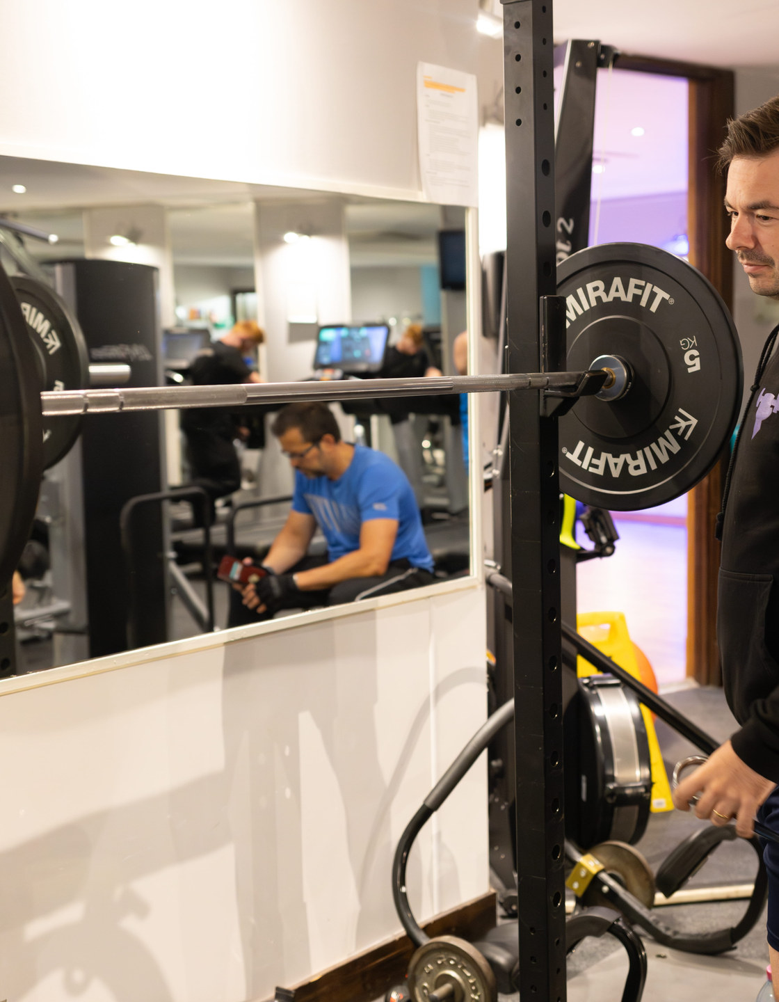 Trainer coaching client in gym